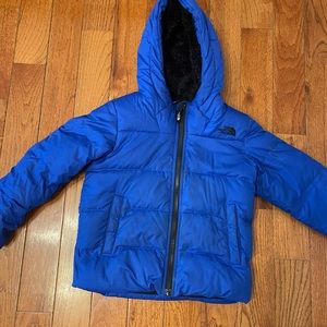 Insulated boys jacket with fluffy black lining. In good condition.